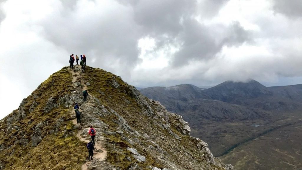 tourists at the peak of a mountain