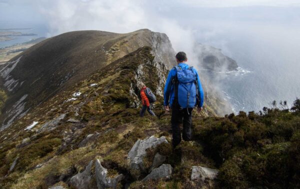 tourists walking on a mountain trail custom guided hike