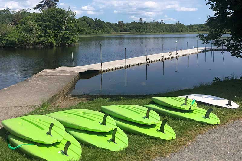 stand up paddles laid out ready for an adventure
