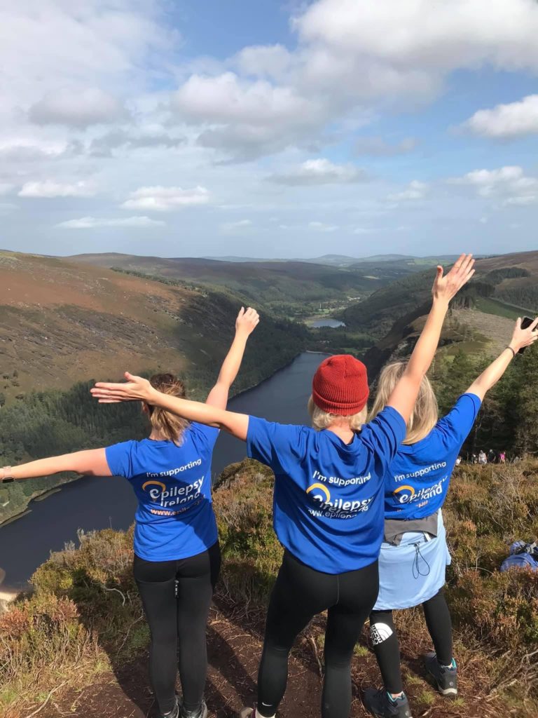 image00027 three women hands in the air on peak on mountain doing hiking adventure charity event